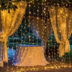 3m by 3m fairy curtain lights with 300 LEDs creating a warm illuminated backdrop